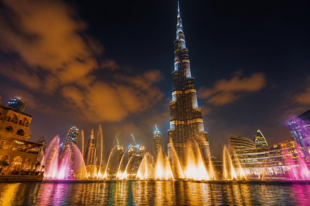 Dubai Fountain show at night with Burj Khalifa in background